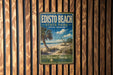 A vintage-style metal sign for Edisto Beach State Park in South Carolina, featuring a palm tree and beach scene.