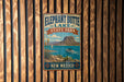 A vintage-style metal sign for Elephant Butte Lake State Park in New Mexico, featuring a scenic illustration of a mountain, lake, and boat.
