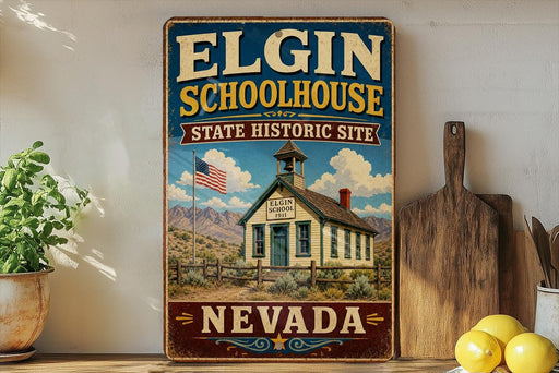 A vintage-style sign for Elgin Schoolhouse, a historic site in Nevada, with a picture of the schoolhouse and a flag.