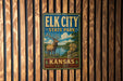 A metal sign for Elk City State Park in Kansas, featuring an illustration of a deer in a natural setting.