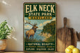A vintage-style sign for Elk Neck State Park, Maryland, featuring an illustration of a deer in a natural setting.