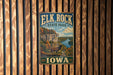 A vintage metal sign for Elk Rock State Park in Iowa, featuring a scenic landscape with a river, cliffs, and wildlife.