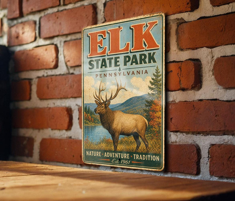 A vintage-style metal sign for Elk State Park in Pennsylvania, featuring an illustration of a deer with antlers and a scenic landscape.