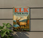 A vintage metal sign for Elk State Park in Pennsylvania, featuring an illustration of a deer with antlers and a scenic landscape.