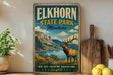 A vintage-style sign for Elkhorn State Park in Montana, featuring a scenic landscape with a deer in the foreground.