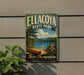A vintage metal sign for Ellacoya State Park, featuring a scenic image of a lake, mountains, and a red canoe, is displayed on a wall.
