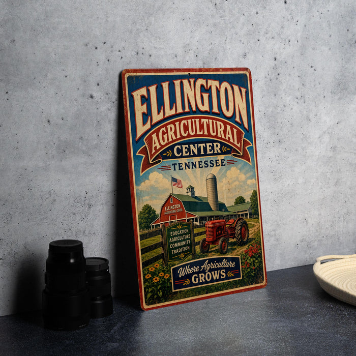 A vintage-style sign for the Ellington Agricultural Center in Tennessee, featuring an illustration of a farm and a tractor.