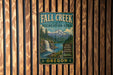 A vintage metal sign for the Fall Creek State Recreation Area in Oregon, featuring a scenic mountain landscape with a waterfall.