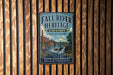 a vintage metal sign for Fall River Heritage State Park in Massachusetts, with a scenic illustration of a waterfall and a bridge.