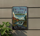 a vintage-style sign for Fall River Heritage State Park in Massachusetts, with a scenic illustration of a waterfall and a bridge.