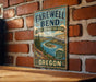 a vintage-style sign for Farewell Bend, a state recreation area in Oregon, mounted on a brick wall.