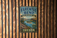 a vintage-style sign for the Farewell Bend State Recreation Area in Oregon, hanging on a wooden wall.