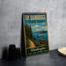 A vintage-style metal sign for "Fay Bainbridge State Park" featuring a scenic image of a mountain, a river, and a picnic area.