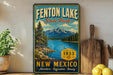 A vintage-style sign for Fenton Lake State Park in New Mexico, featuring a scenic landscape with mountains, pine trees, and a lake.