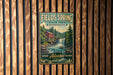 A vintage-style metal sign for Fields Spring State Park in Washington, featuring a waterfall and a red building in the background.