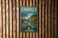 A vintage-style metal sign for Findley State Park in Ohio, featuring a scenic landscape with a river and trees.