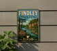 A vintage-style metal sign for Findley State Park, featuring a scenic landscape with a river and trees, mounted on a wall.