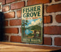 A vintage-style sign for Fisher Grove State Park in South Dakota, featuring a scenic landscape with a lake, mountains, and pine trees.