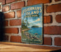 A vintage-style metal sign for Fisherman's Island State Park in Michigan, featuring a scenic image of the island and its surrounding waters.