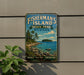 A vintage-style sign for Fisherman's Island State Park in Michigan, featuring a scenic landscape with a lake, mountains, and pine trees.