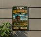 A vintage-style sign for Fort Abraham Lincoln State Park in North Dakota, featuring a cannon and a wooden building in the background.