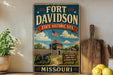 A vintage-style metal sign for the Fort Davidson State Historic Site in Missouri, featuring an illustration of a cannon, a wooden fence, and a sign indicating the site's history.