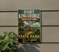 A vintage-style sign for Fort King George Historic Site in Georgia, featuring a painting of a historic building and landscape.