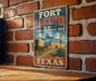 A vintage-style metal sign for the Fort Lancaster State Historic Site in Texas, featuring an illustration of a wagon and a building.