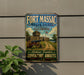 A vintage metal sign for Fort Massac State Park in Illinois, featuring a cannon and a wooden fort, with the text "Historic Frontier Adventure Awaits" and "FORT MASSAC STATE PARK ILLINOIS".