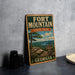 A vintage-style metal sign for Fort Mountain State Park in Georgia, featuring a scenic landscape with a tree and a river.