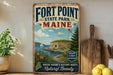 A vintage-style metal sign for Fort Point State Park in Maine, featuring a scenic illustration of the park and its surroundings.