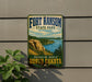 A vintage-style sign for Fort Ransom State Park, featuring a scenic landscape with a river and mountains in the background.