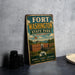 A vintage metal sign for Fort Washington State Park in Maryland, featuring an illustration of the park's historic fort and surrounding landscape.