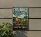 A vintage metal sign for Fox Ridge State Park in Illinois, featuring a fox in a scenic landscape.