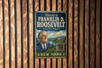 A vintage-style metal sign welcoming visitors to Franklin D. Roosevelt State Park in New York.