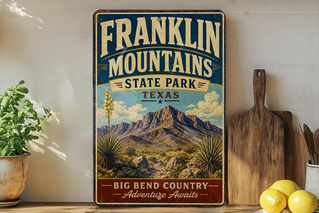 A vintage Franklin Mountains State Park sign is displayed on a shelf, with a potted plant and a cutting board nearby.
