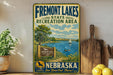a vintage-style sign for Fremont Lakes State Recreation Area in Nebraska, with a scenic illustration of the lake and surrounding landscape.