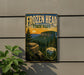 A vintage-style sign for Frozen Head State Park, featuring a scenic mountain landscape with pine trees and rocky cliffs.