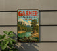 A vintage-style sign for Garner State Park in Texas, featuring a scenic landscape with a river and mountains.