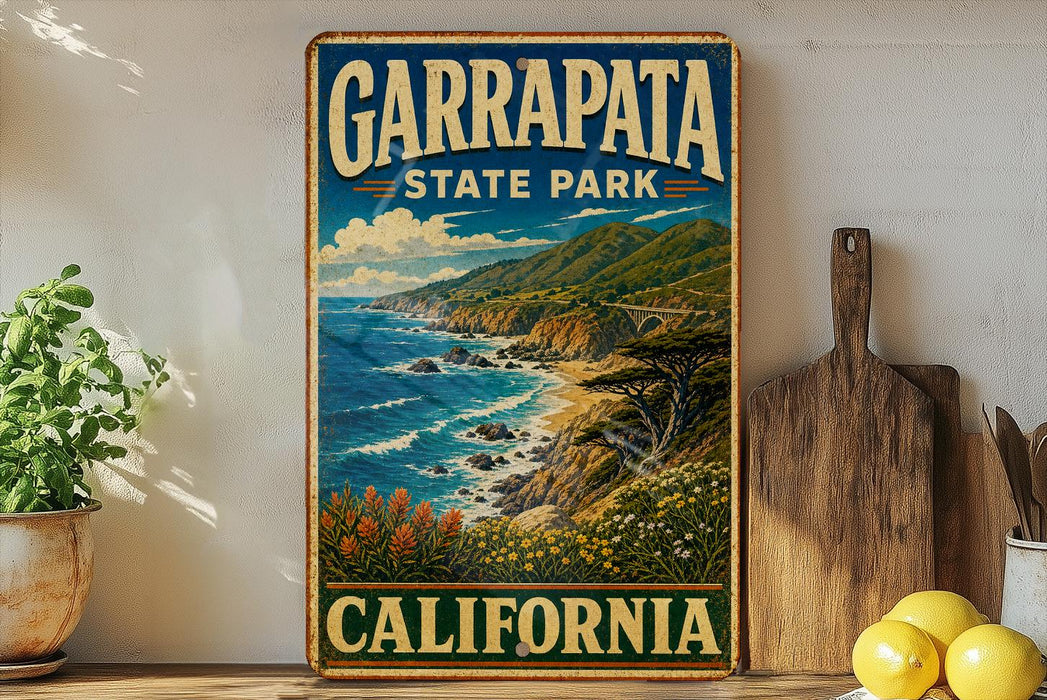 A vintage-style poster of Garrapata State Park in California, featuring a scenic coastal landscape with mountains, ocean, and flowers.