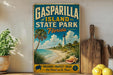 A vintage-style sign for Gasparilla Island State Park in Florida, featuring a beach scene with palm trees, a lighthouse, and a seashell.