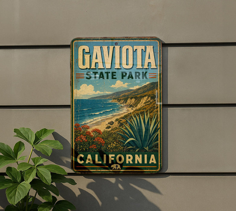 A vintage-style metal sign for Gaviota State Park in California, featuring a scenic landscape with mountains, a beach, and desert vegetation.