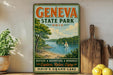 a vintage-style metal sign for Geneva State Park, Ohio, with a scenic illustration of a lake and a sailboat. The sign encourages visitors to "Explore. Relax. Enjoy." and highlights the park's offerings of nature, adventure, and memories.