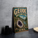 A vintage-style metal sign for Geode State Park in Iowa, featuring an image of a large geode and a scenic landscape.