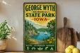 A vintage-style sign for George Wyth Memorial State Park in Iowa, featuring a scenic landscape with a lake, mountains, and a sailboat.