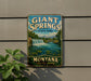 A vintage-style metal sign for Giant Springs State Park in Montana, featuring a scenic landscape with a waterfall and mountains.
