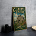 A vintage-style metal sign for Gillette Castle State Park in Connecticut, featuring an illustration of the castle and the words "Gillette Castle State Park Connecticut" on it.
