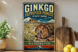 A vintage-style metal sign for Ginkgo Petrified Forest State Park in Washington, featuring an illustration of a large petrified tree trunk and a mountainous landscape.