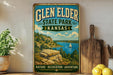 A vintage-style sign for Glen Elder State Park in Kansas, featuring a scenic landscape with a lake, mountains, and a sailboat.