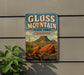 A vintage-style metal sign for Gloss Mountain State Park in Oklahoma, featuring a desert landscape with mountains and cacti.